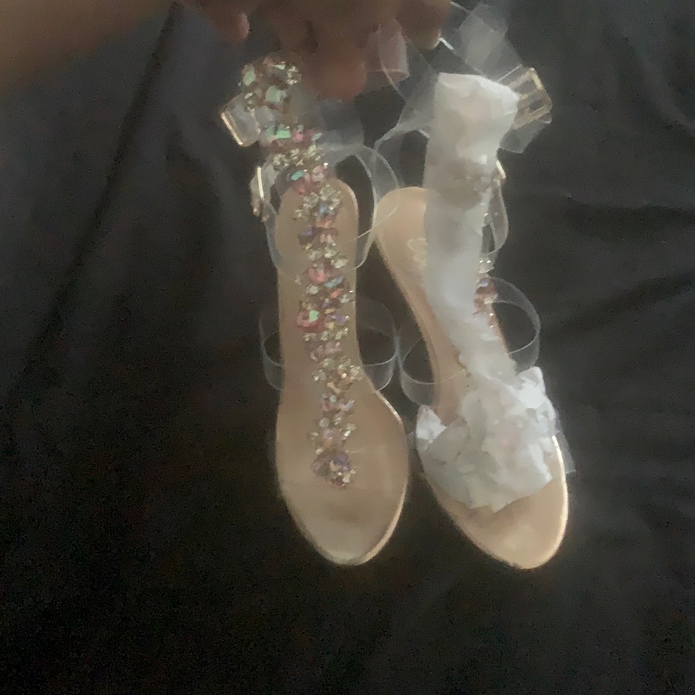 Brand new never worn cute clear heels with rhinestones.